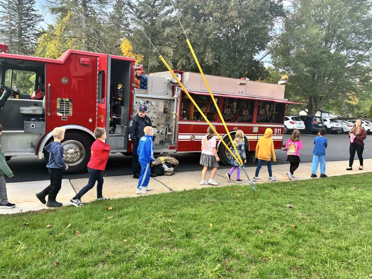 Students exploring the fire