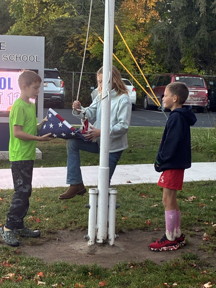 patriot leaders putting up the flag
