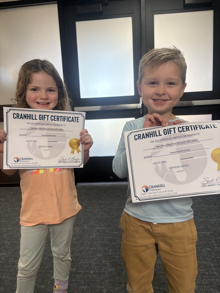 students holding gift certificates 