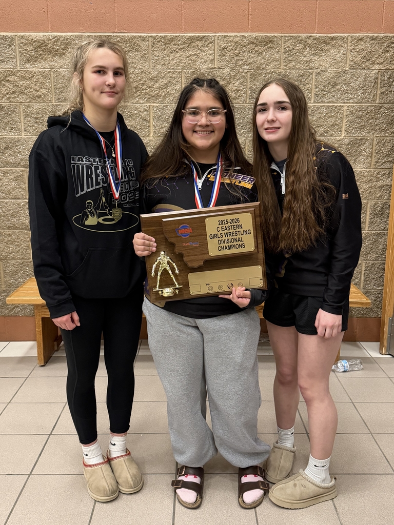 Championship Finishers with wrestling trophy