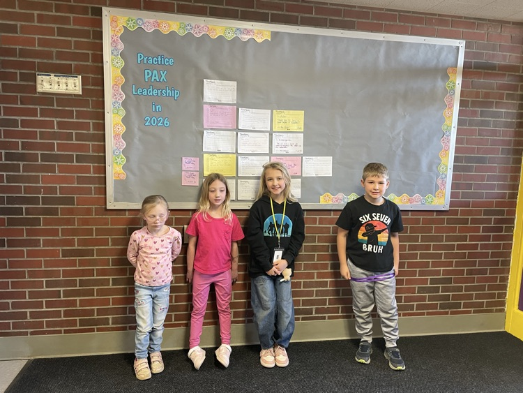 Pyper, Lily, Edie, and Landen in front of our PAX board 