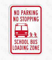 Bus zone sign, reminding families of Jr. High and High School Students to pick up students at the wagon entrance and not the south side of the school. 