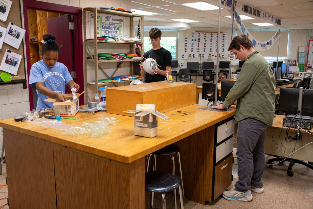 project lead the way students build egg drop containers in class
