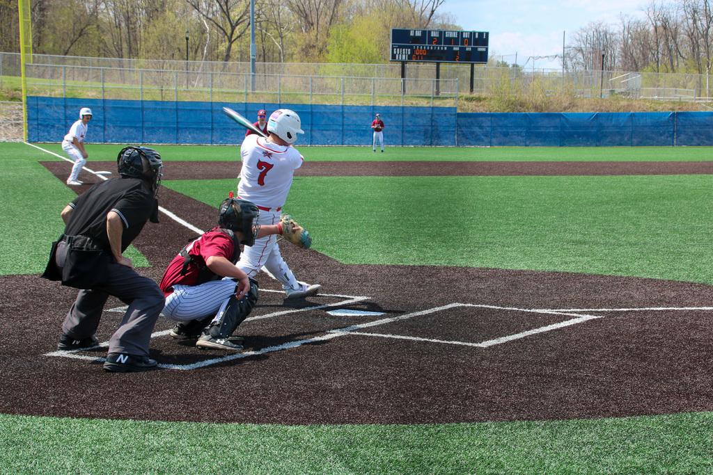 binghamton player makes contact with ball while batting