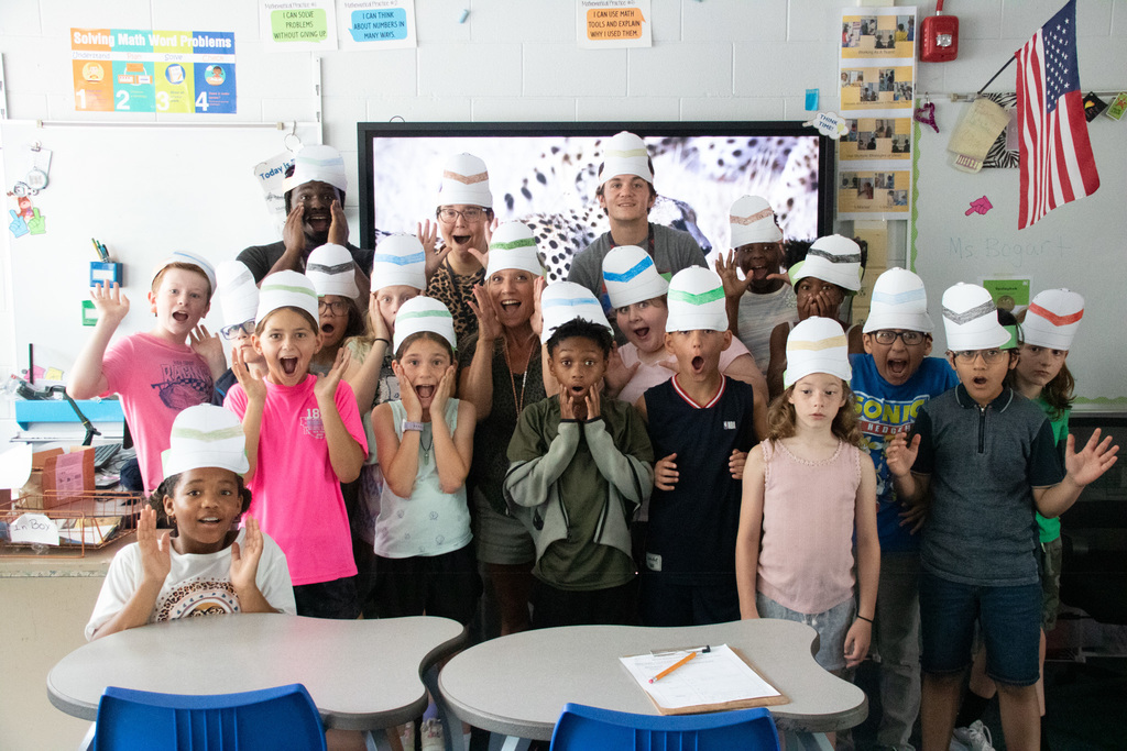 students wearing safari hats they made during imagination adventure