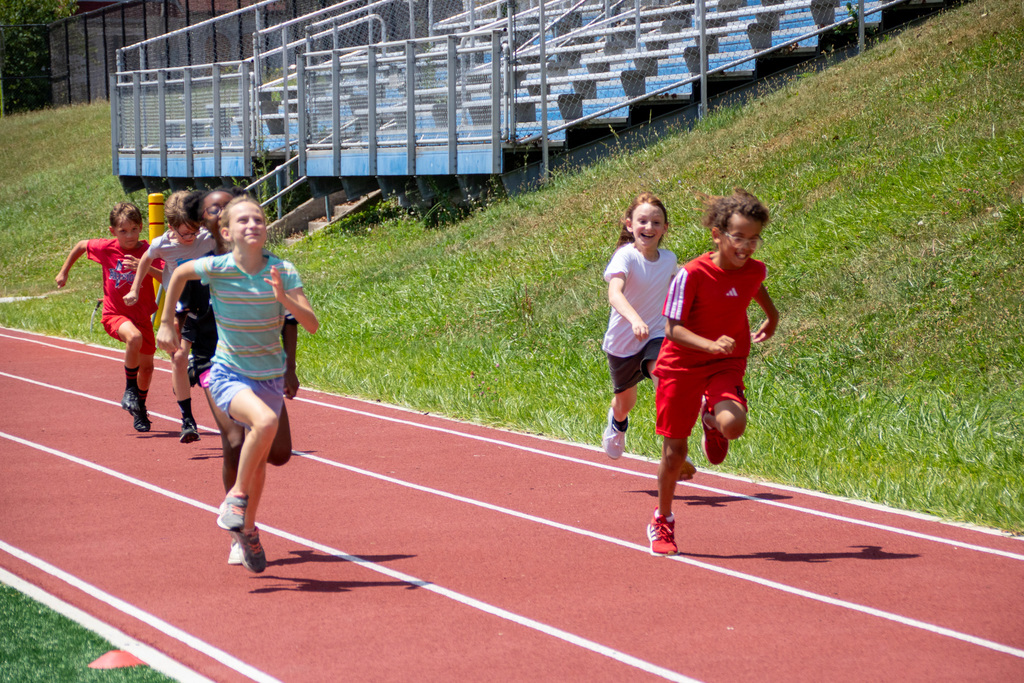 students practice sprinting at patriots track camp