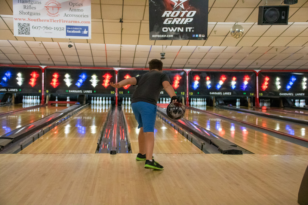 student throws ball during bowling camp