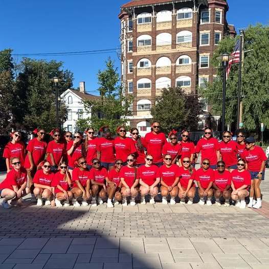 bhs cheer teams pose for photo before leaving for cheer camp