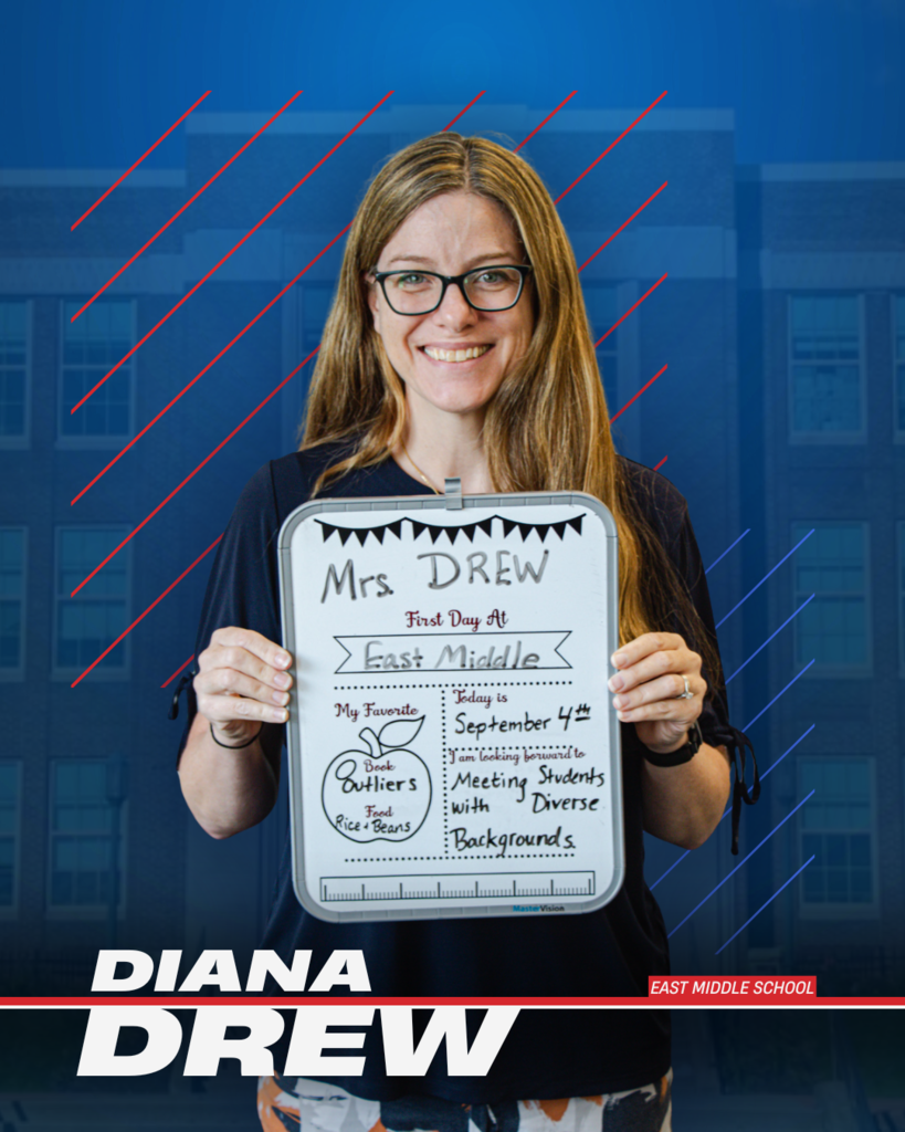 photo of diana drew holding back to school info board