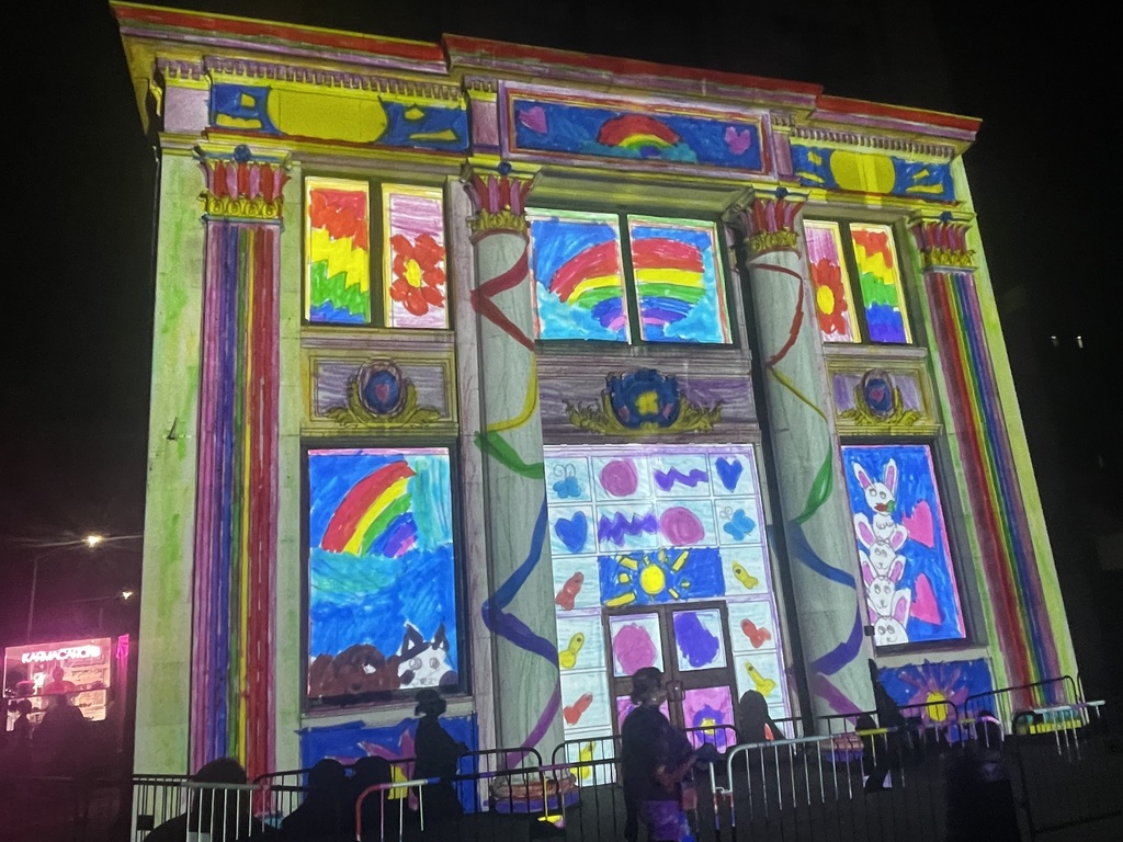 artwork by fiona smeu projected onto building in downtown binghamton