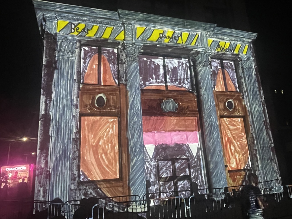 artwork by brock haynes projected onto building in downtown binghamton