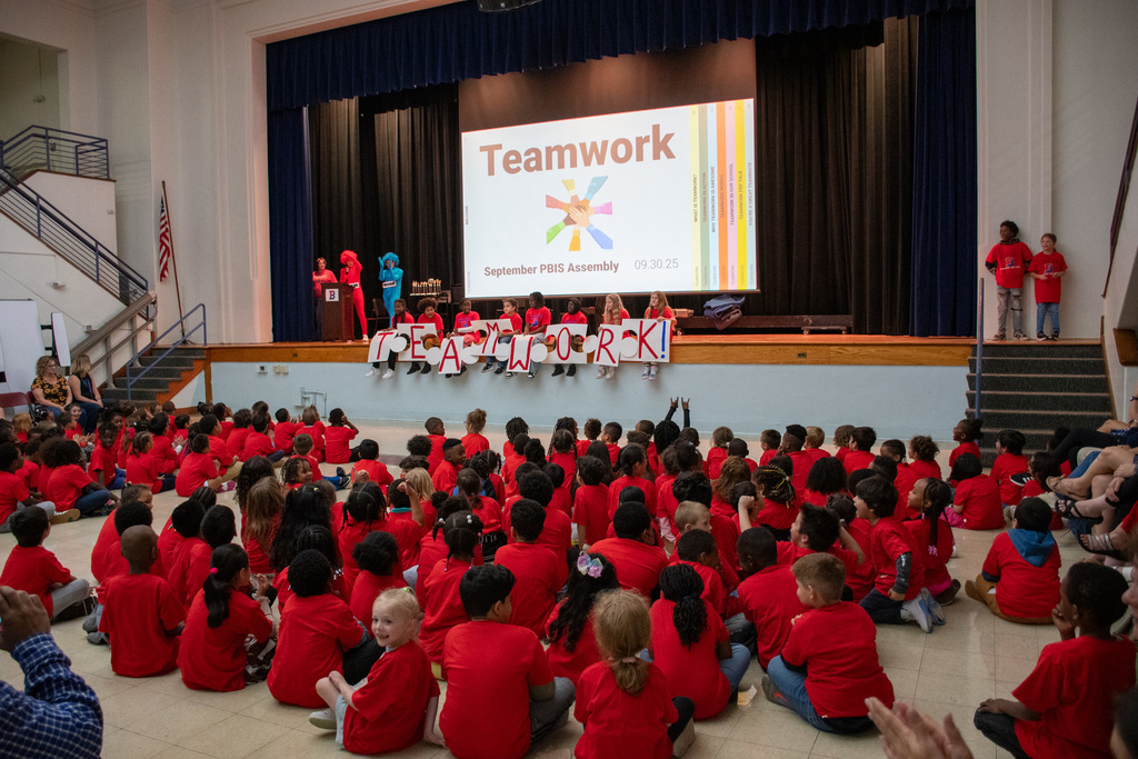 students sit in auditorium at woodrow wilson for assembly