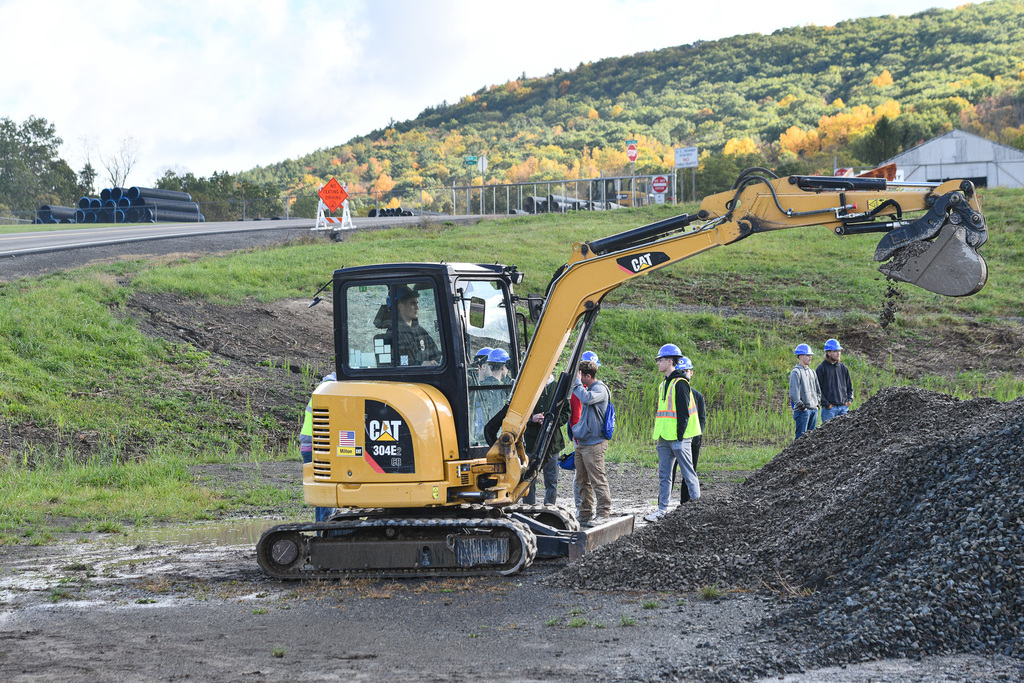 student operates construction equipment