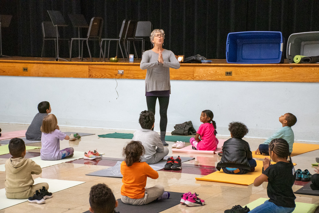 wilson first graders do yoga in cafeteria