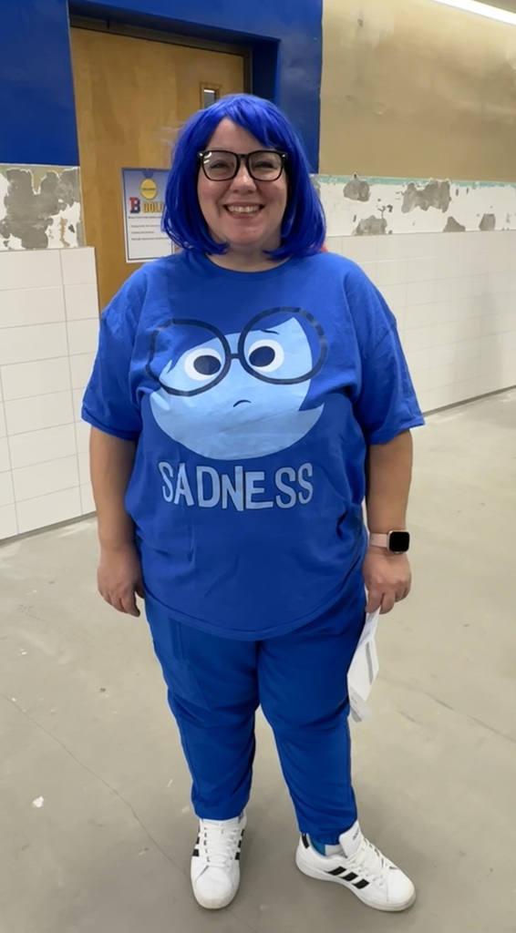 staff member in all blue costume