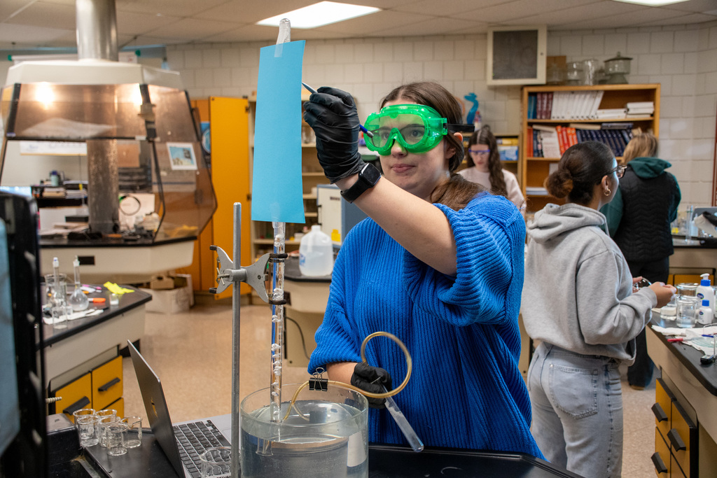 chemistry student works on lab project