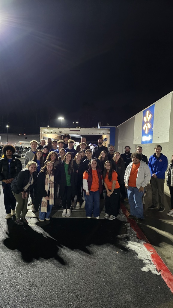 visions credit union student interns pose for photo outside walmart