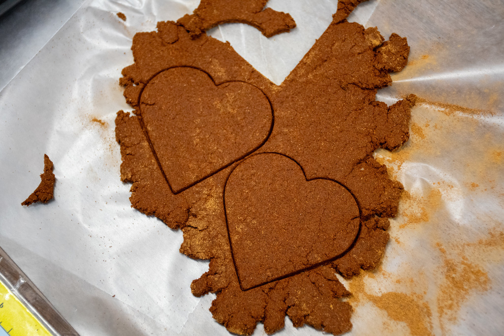 two heart shapes cut into dough