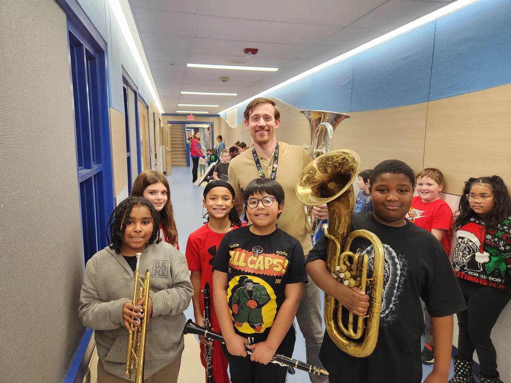 band students and teacher pose for photo