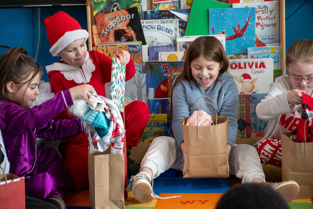 wilson students open holiday gifts