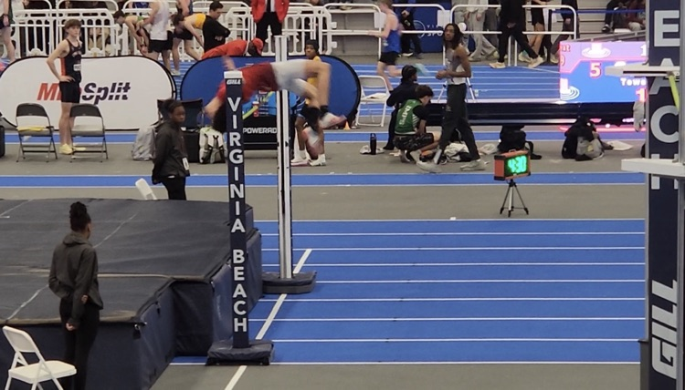 Milo Wilson extends his body over the 6’10” high jump bar
