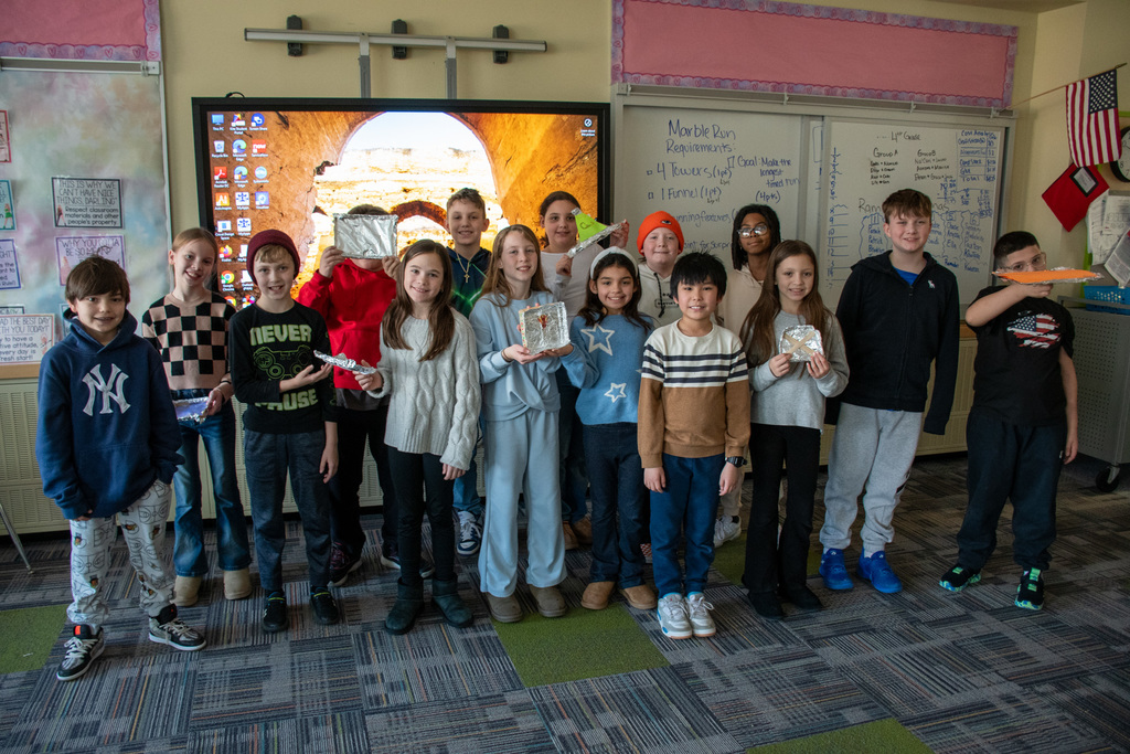 macarthur students show off boats they made in challenge enrichment class