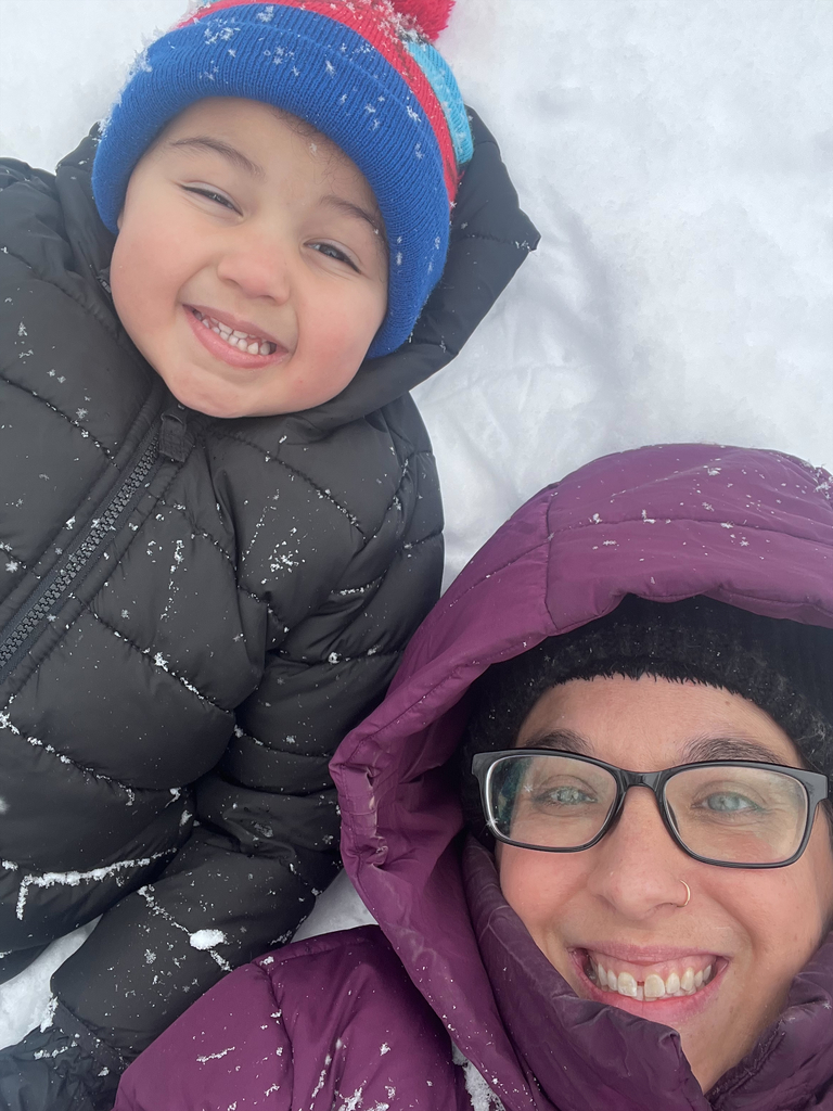 child and adult smiling for a selfie