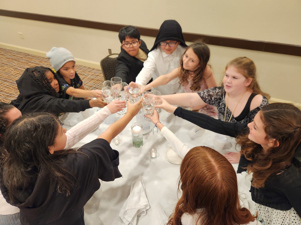students toast water glasses