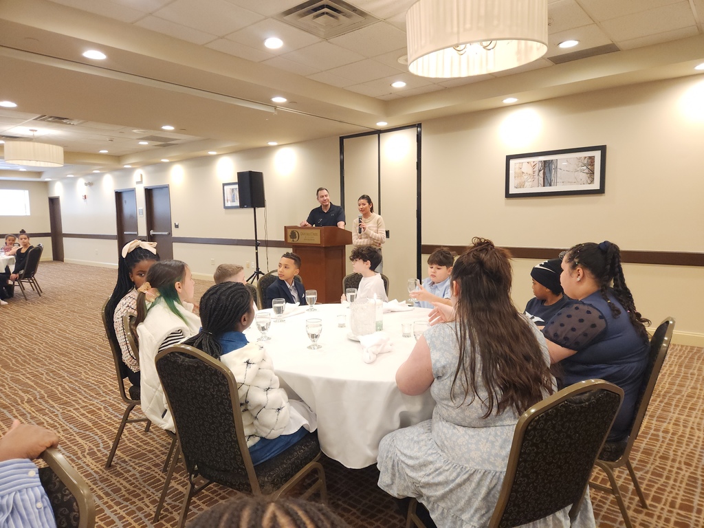 students listen to philharmonic soloist speak