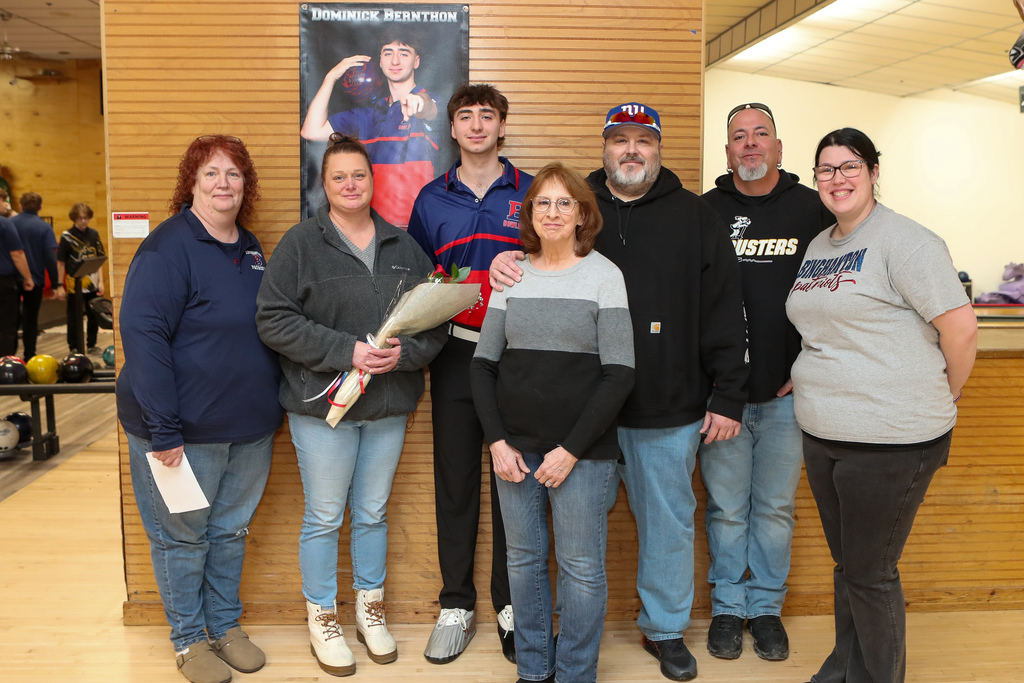 dom bernthon with his coaches and family on senior night