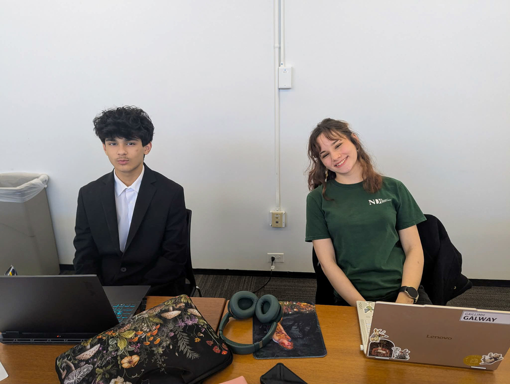 two bhs debate students pose for photo