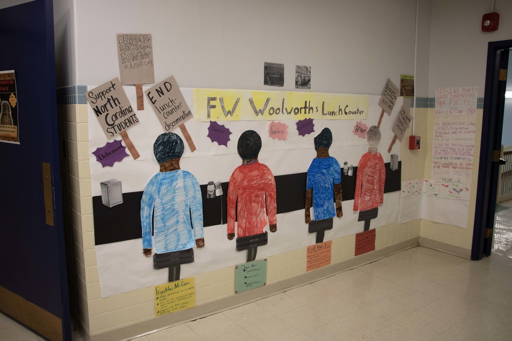 West Middle Students showed community partners the building's black history month exhibits