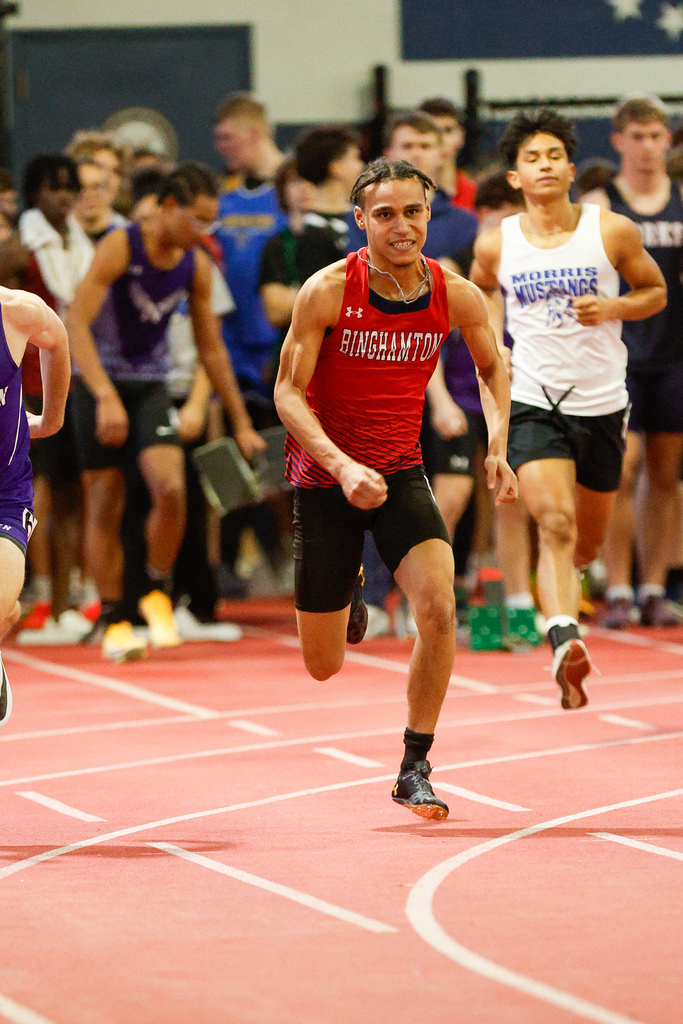 student starts sprint at indoor track meet