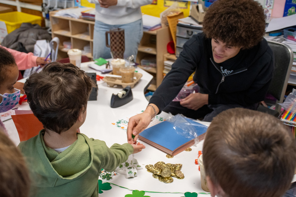 bhs visions fcu intern hands out supplies