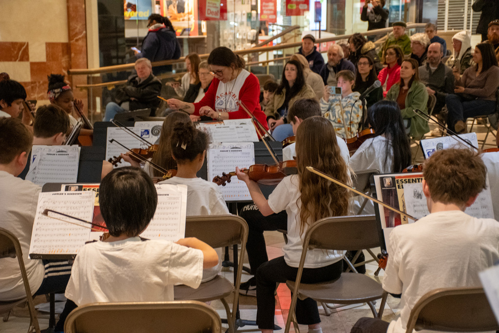 macarthur orchestra students play at oakdale commons