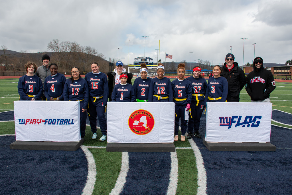 binghamton flag football players and coaches pose for photo with former ny giants ryan nassib and jonathan casillas