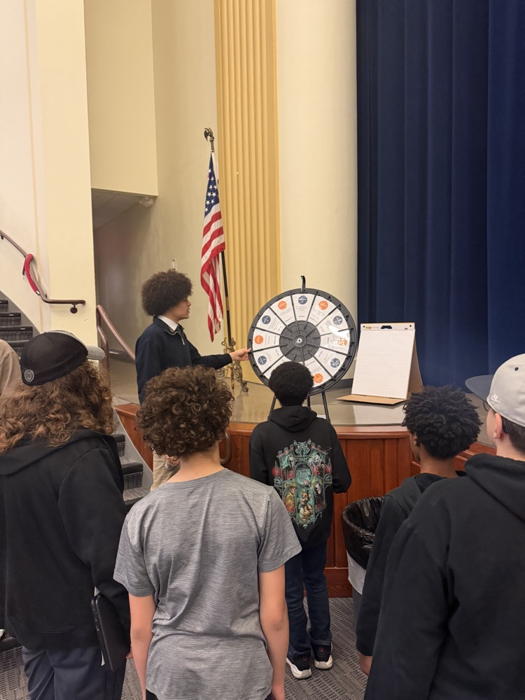 visions fcu intern works with students at East Middle