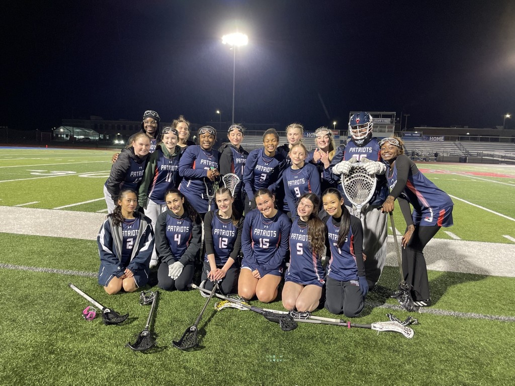 binghamton girls varsity lacrosse team poses for a photo after a win against owego