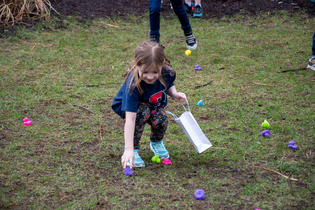 jefferson kindergarten student picks up rubber duck during duck hunt