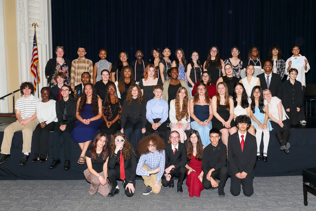 members of tri-m honor society pose for phot at induction ceremony