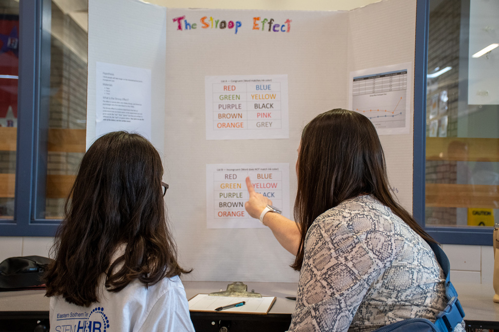 Calvin Coolidge principal participates in science experiment