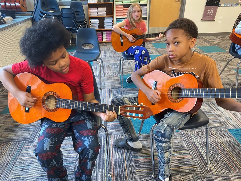 macarthur students play guitar
