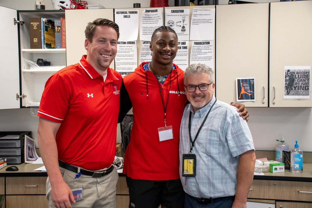 colbie young poses for photo with two of his former teachers at BHS