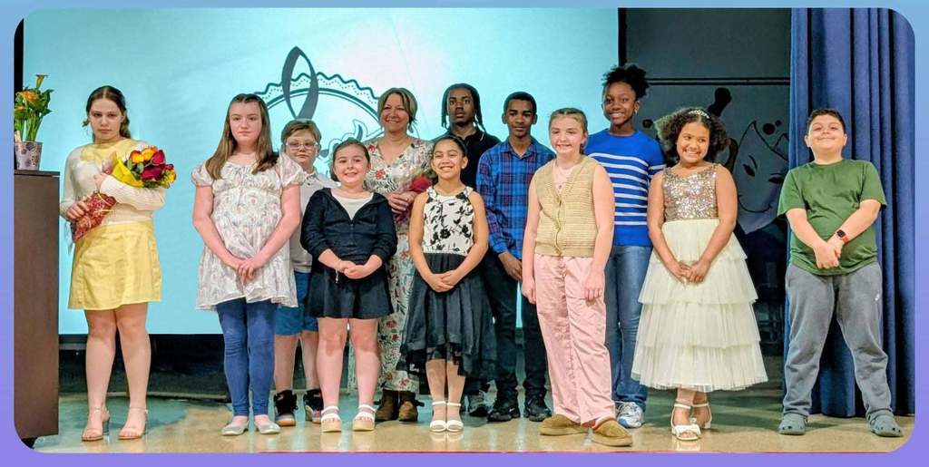 students taking piano lessons from mrs. tigue pose for photo on stage at calvin coolidge
