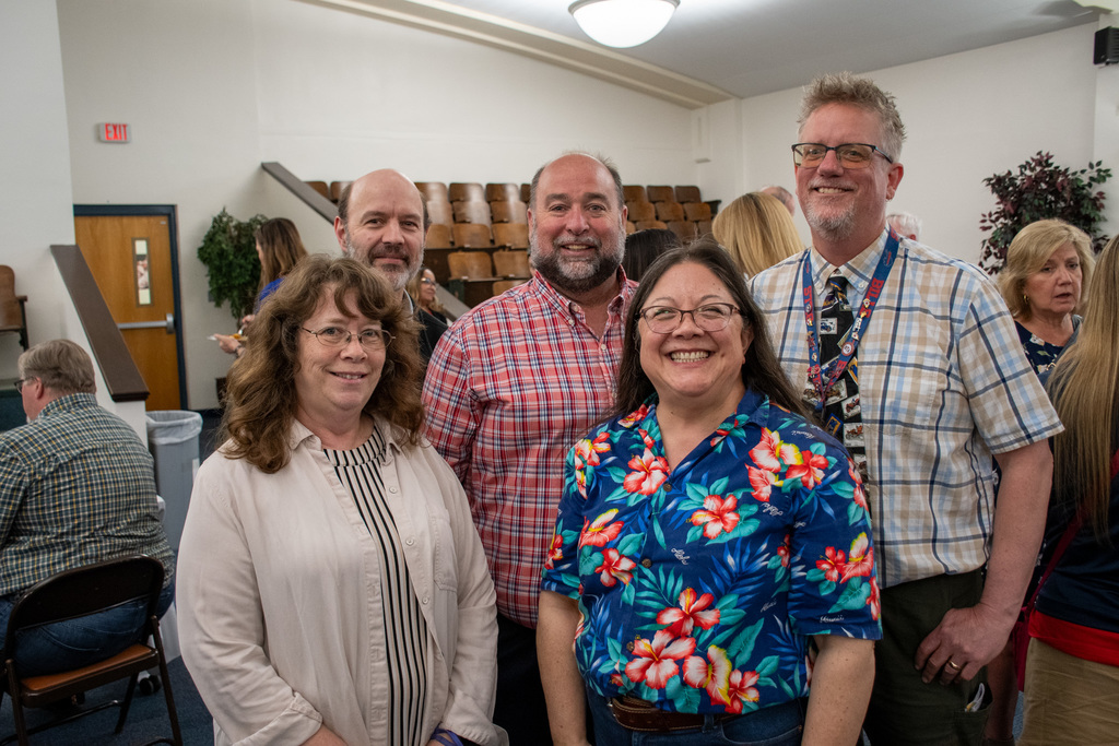 five staff members from west middle school pose for photo