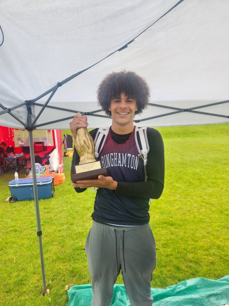 Milo Wilson holds 1st place trophy from Loucks Games