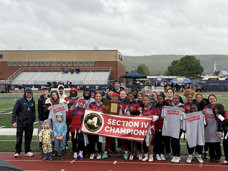 Binghamton flag football team holding section 4 championship banner