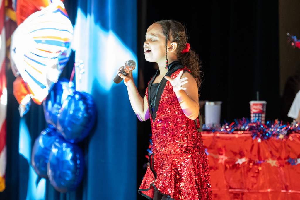 macarthur student sings on stage