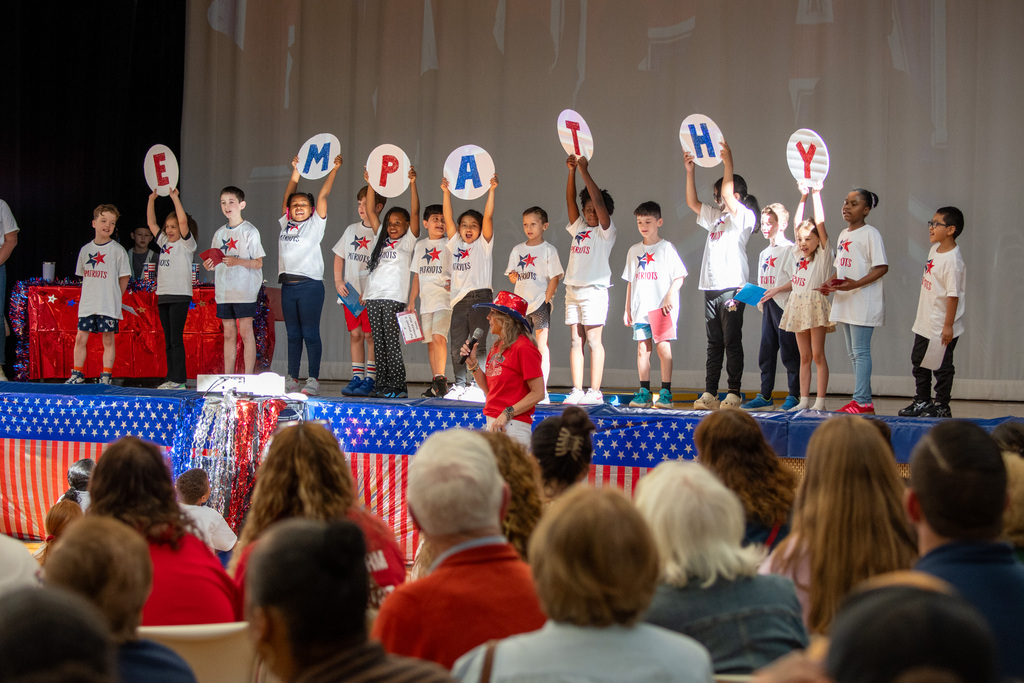 macarthur students hold up letters spelling "empathy"
