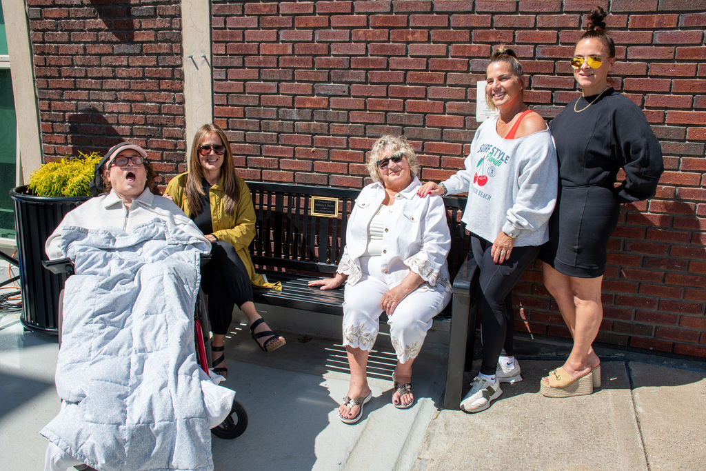 Tony Stento's wife and four daughters pose for photo with the newly installed Tony Stento memorial bench at BHS